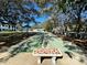 Community bocce ball court with shaded seating at 8651 10Th N St # 118, St Petersburg, FL 33702