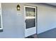 Condo entrance with a screen door and welcome mat at 8651 10Th N St # 118, St Petersburg, FL 33702