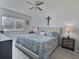 Large main bedroom with a king-size bed and nightstands at 8651 10Th N St # 118, St Petersburg, FL 33702