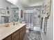 Clean bathroom with shower/tub combo and double vanity at 8651 10Th N St # 118, St Petersburg, FL 33702