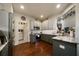 Modern kitchen with stainless steel appliances and gray cabinets at 2539 Silverback Ct, Palm Harbor, FL 34684