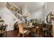 Elegant dining room with a chandelier, hardwood floors, and a view of the staircase at 2539 Silverback Ct, Palm Harbor, FL 34684