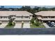 Two-story townhouses with attached garages and landscaping at 2539 Silverback Ct, Palm Harbor, FL 34684