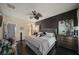 Spacious main bedroom with dark wood floors, a king-size bed and a ceiling fan at 2539 Silverback Ct, Palm Harbor, FL 34684