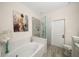 Spa-like bathroom with soaking tub, walk-in shower, and mosaic tile at 2539 Silverback Ct, Palm Harbor, FL 34684