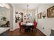 Charming breakfast nook with a round table and red chairs at 2539 Silverback Ct, Palm Harbor, FL 34684