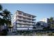 Modern beach condo building with multiple levels and balconies at 10126 Gulf Blvd # Ph2, Treasure Island, FL 33706
