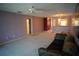 Living Room with carpet, ceiling fan, and view to kitchen at 1601 43Rd S N St # 224, St Petersburg, FL 33713