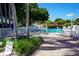 Community pool with surrounding patio furniture at 1601 43Rd S N St # 224, St Petersburg, FL 33713