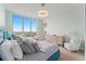 Spacious bedroom with a dresser, and a view from a large window at 3401 Bayshore Blvd # 1801, Tampa, FL 33629