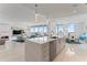 Open concept kitchen with white quartz countertops and stainless steel appliances at 3401 Bayshore Blvd # 1801, Tampa, FL 33629