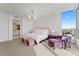 Main bedroom with plush bedding, sitting area and water views at 3401 Bayshore Blvd # 1801, Tampa, FL 33629