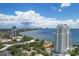 Aerial view of high-rise building near bay and city skyline at 3401 Bayshore Blvd # 1801, Tampa, FL 33629