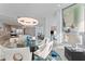 Elegant dining room with a round glass table and modern light fixture at 3401 Bayshore Blvd # 1801, Tampa, FL 33629