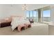 Bright and airy main bedroom with water views and luxurious bedding at 3401 Bayshore Blvd # 1801, Tampa, FL 33629