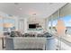 Modern living room with media wall, comfortable seating, and water views at 3401 Bayshore Blvd # 1801, Tampa, FL 33629