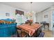 Charming dining room with a table, chairs and chandelier at 36750 Kimela Ave, Zephyrhills, FL 33542