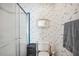 Bathroom with shower, toilet, and storage at 36750 Kimela Ave, Zephyrhills, FL 33542