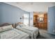 Bedroom with two twin beds and en-suite bathroom at 36750 Kimela Ave, Zephyrhills, FL 33542