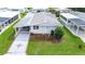 Single-story home with carport and landscaped yard at 36750 Kimela Ave, Zephyrhills, FL 33542