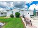 View of home's exterior and backyard patio at 36750 Kimela Ave, Zephyrhills, FL 33542