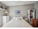 Bedroom with double bed, dresser, and home office space at 36750 Kimela Ave, Zephyrhills, FL 33542