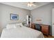 Bedroom with double bed, dresser, and home office space at 36750 Kimela Ave, Zephyrhills, FL 33542