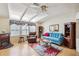 Living room featuring vaulted ceilings, comfy furniture, and fireplace at 36750 Kimela Ave, Zephyrhills, FL 33542