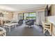 Living room with seating area, coffee table, and balcony access at 36750 Us Highway 19 N # 04308, Palm Harbor, FL 34684