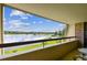 Stunning balcony view of the lake and lush landscape at 36750 Us Highway 19 N # 04308, Palm Harbor, FL 34684