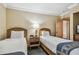 Guest bedroom with two twin beds and golf course view at 36750 Us Highway 19 N # 04308, Palm Harbor, FL 34684