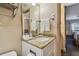 Bathroom with granite countertop and single sink vanity at 36750 Us Highway 19 N # 04308, Palm Harbor, FL 34684
