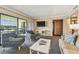 Spacious living room with lake view, comfy seating and large screen TV at 36750 Us Highway 19 N # 04308, Palm Harbor, FL 34684