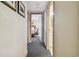 Hallway leading to bedroom and bathroom, featuring neutral decor at 36750 Us Highway 19 N # 04308, Palm Harbor, FL 34684