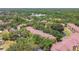 Panoramic aerial view of the residential complex, green landscape, and a tranquil water feature at 5608 Pinnacle Heights Cir # 305, Tampa, FL 33624