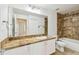 Bathroom with white cabinets and shower-tub combo at 5608 Pinnacle Heights Cir # 305, Tampa, FL 33624