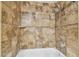 Bathroom featuring a tiled shower and bathtub with a shower head at 5608 Pinnacle Heights Cir # 305, Tampa, FL 33624