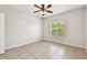 The bedroom has light-filled space and tile flooring at 5608 Pinnacle Heights Cir # 305, Tampa, FL 33624
