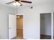 Bright bedroom with ceiling fan, neutral walls, and ample closet space at 5608 Pinnacle Heights Cir # 305, Tampa, FL 33624