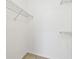 Walk in closet with wire shelving and neutral tile flooring at 5608 Pinnacle Heights Cir # 305, Tampa, FL 33624