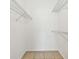 Walk in closet with wire shelving and neutral tile flooring at 5608 Pinnacle Heights Cir # 305, Tampa, FL 33624