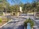 Gated entrance to a residential community with manicured landscaping and serene surroundings at 5608 Pinnacle Heights Cir # 305, Tampa, FL 33624