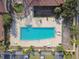 An aerial view showcasing the community pool and seating areas at 5608 Pinnacle Heights Cir # 305, Tampa, FL 33624