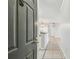 Home entry with white cabinetry and granite countertops at 5608 Pinnacle Heights Cir # 305, Tampa, FL 33624