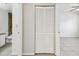 Hallway with closet doors leading to bathroom and bedroom at 5608 Pinnacle Heights Cir # 305, Tampa, FL 33624