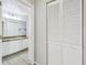 Hallway leading to bathroom with closet for storage at 5608 Pinnacle Heights Cir # 305, Tampa, FL 33624