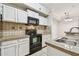 Cozy kitchen with stainless steel appliances and granite countertops at 5608 Pinnacle Heights Cir # 305, Tampa, FL 33624