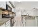 Bright kitchen with stainless steel sink and granite countertops at 5608 Pinnacle Heights Cir # 305, Tampa, FL 33624