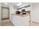 Stylish kitchen with granite countertops, tiled backsplash, and stainless appliances at 5608 Pinnacle Heights Cir # 305, Tampa, FL 33624