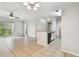 Bright living room featuring neutral tile flooring and access to a private balcony at 5608 Pinnacle Heights Cir # 305, Tampa, FL 33624
